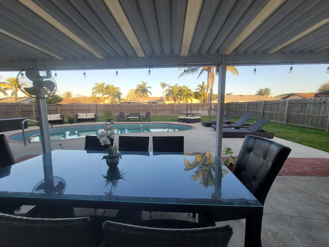 view of patio / terrace with a fenced in pool