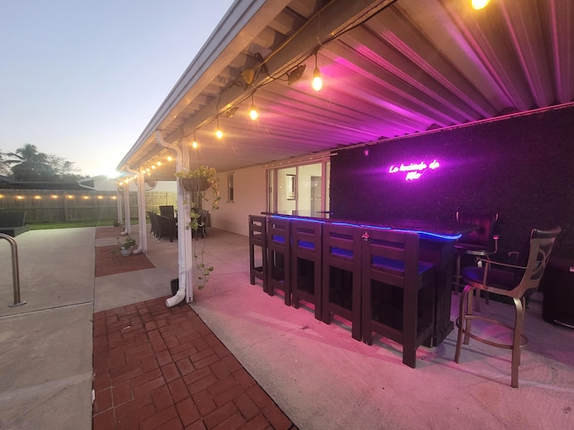 view of patio terrace at dusk