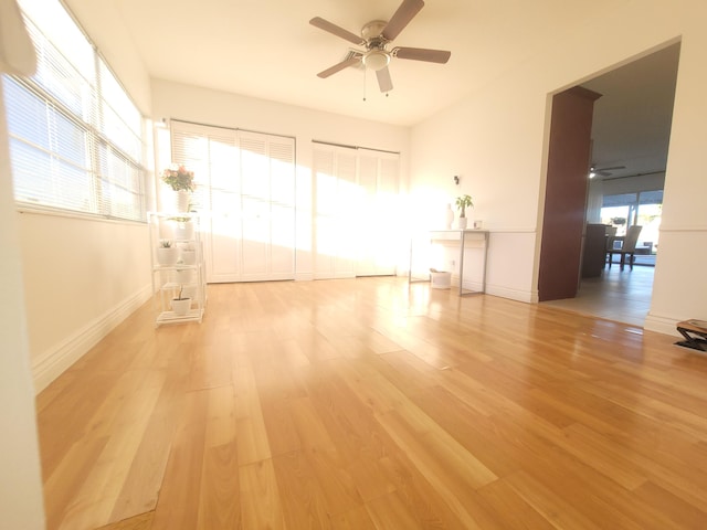 spare room featuring ceiling fan and light hardwood / wood-style floors