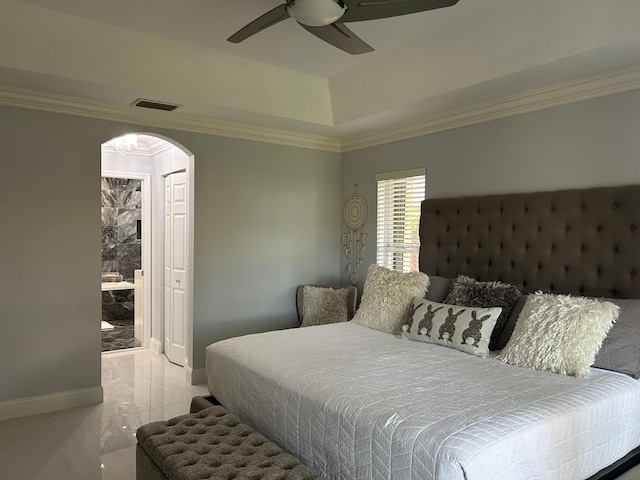 bedroom with crown molding, a raised ceiling, arched walkways, marble finish flooring, and ceiling fan