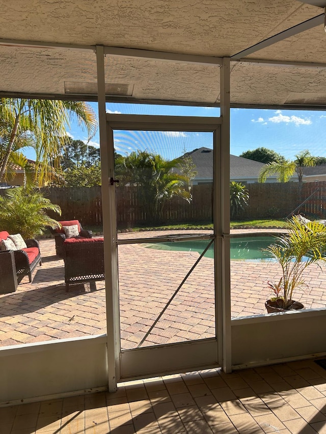 doorway to outside with tile patterned floors
