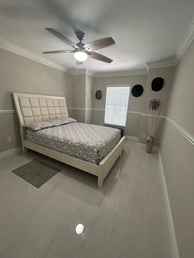 bedroom with crown molding, a ceiling fan, and baseboards