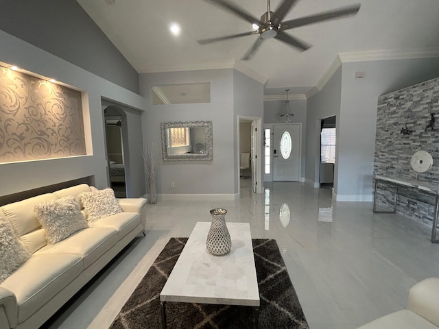 living area featuring a ceiling fan, baseboards, ornamental molding, arched walkways, and high vaulted ceiling