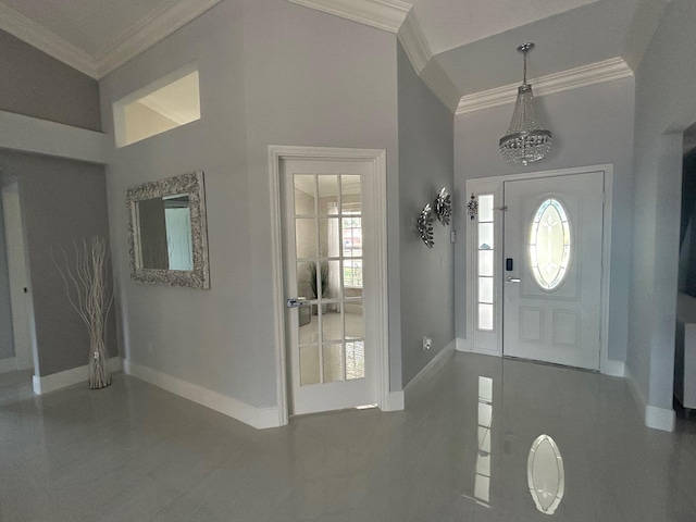 foyer entrance featuring ornamental molding and baseboards