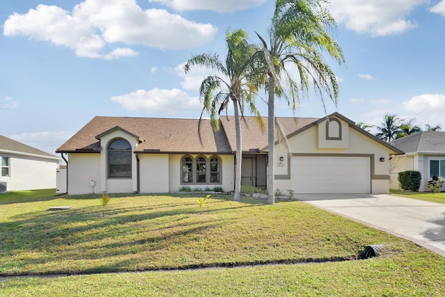 single story home with a garage and a front lawn