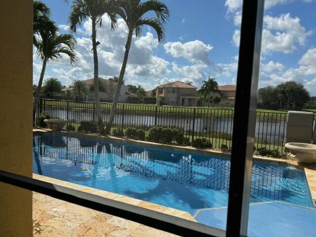 view of pool featuring a water view