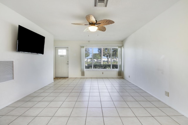 unfurnished living room with light tile patterned floors and ceiling fan