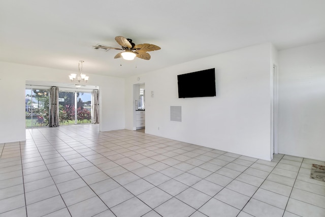 empty room featuring ceiling fan with notable chandelier