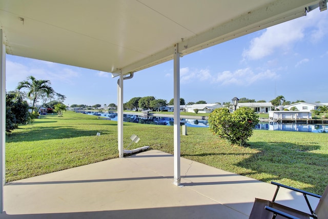 view of patio with a water view