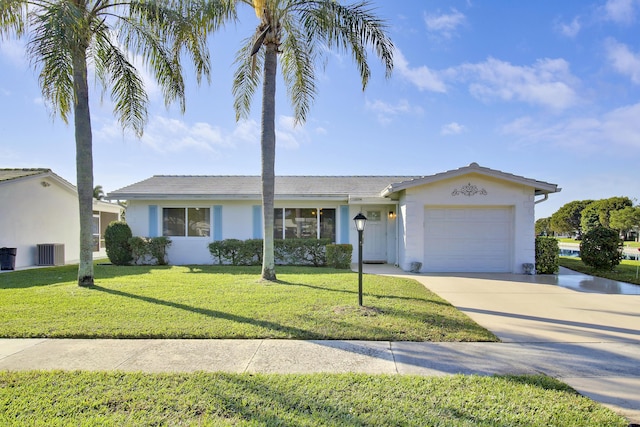 single story home with central AC unit, a garage, and a front yard