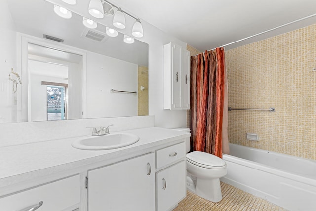 full bathroom with vanity, toilet, tile patterned flooring, and shower / bath combo