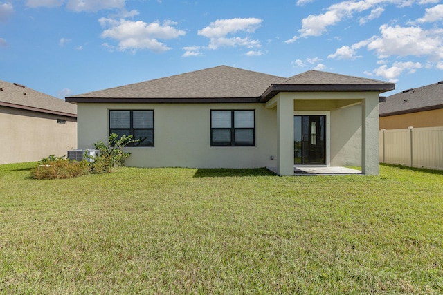 3580 Foggy Mist Rd SE, Palm Bay, FL 32909 - back of property with stucco siding, a shingled roof, and a patio area