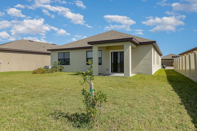 3580 Foggy Mist Rd SE, Palm Bay, FL 32909 - rear view of house featuring stucco siding, central AC unit, and a shingled roof