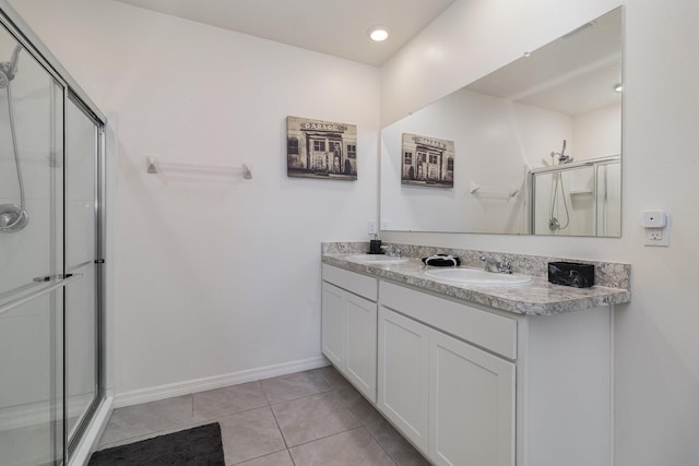 3580 Foggy Mist Rd SE, Palm Bay, FL 32909 - full bath featuring a stall shower, tile patterned flooring, baseboards, and double vanity