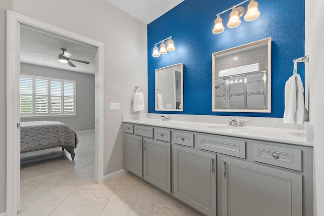 bathroom with vanity, ceiling fan, and walk in shower