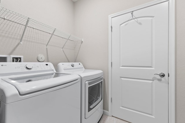 laundry room featuring washer and clothes dryer