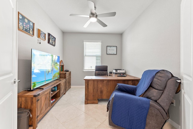 home office featuring light tile patterned floors and ceiling fan