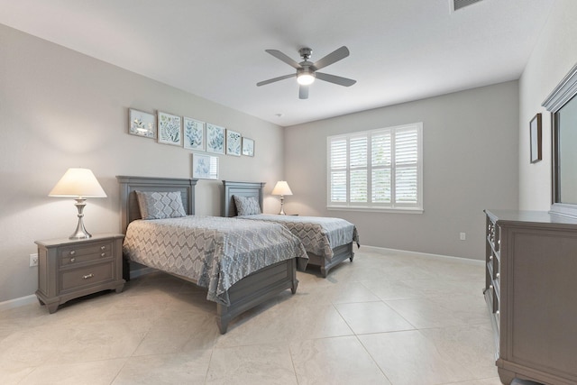 tiled bedroom featuring ceiling fan