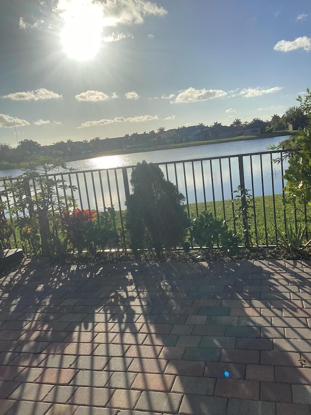 view of patio featuring a water view