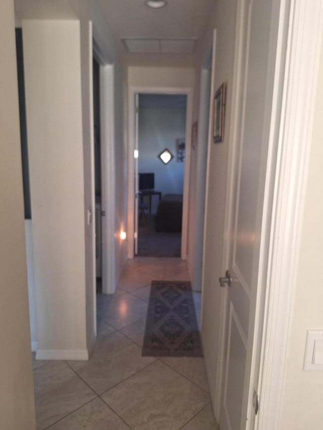 hallway featuring light tile patterned floors