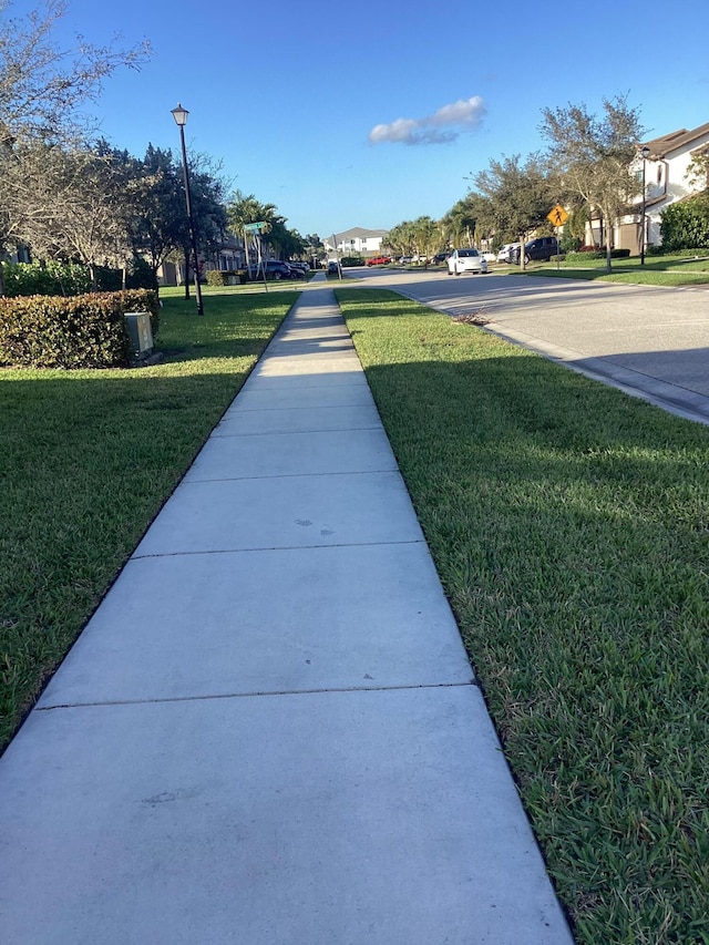 view of community featuring a yard