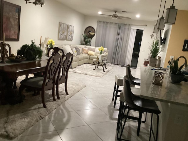 dining room featuring light tile patterned floors and ceiling fan