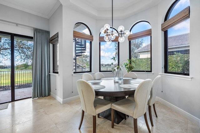 dining space featuring an inviting chandelier and ornamental molding