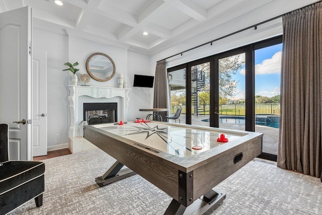 game room with beamed ceiling, plenty of natural light, coffered ceiling, and hardwood / wood-style floors