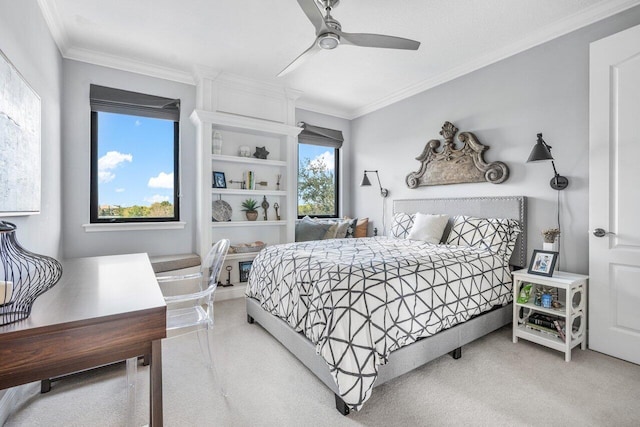 carpeted bedroom featuring ornamental molding and ceiling fan