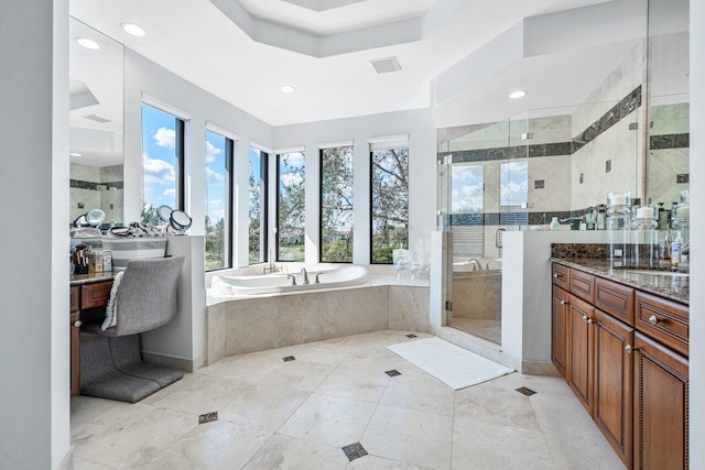 bathroom featuring vanity, tile patterned floors, and independent shower and bath