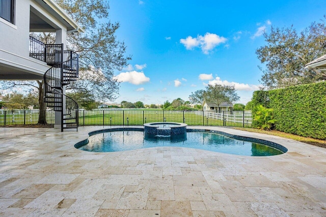 view of pool with an in ground hot tub and a patio