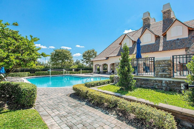 view of swimming pool with a patio area