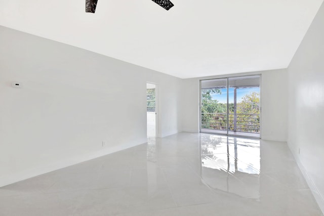 unfurnished room with light tile patterned floors