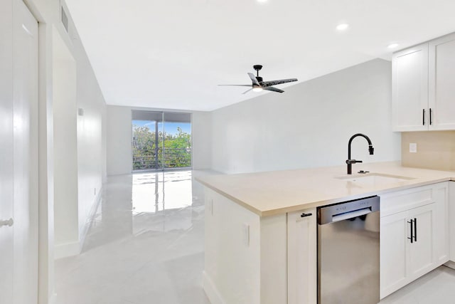 kitchen featuring sink, dishwasher, kitchen peninsula, ceiling fan, and white cabinets