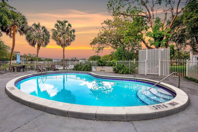 pool featuring a patio and fence