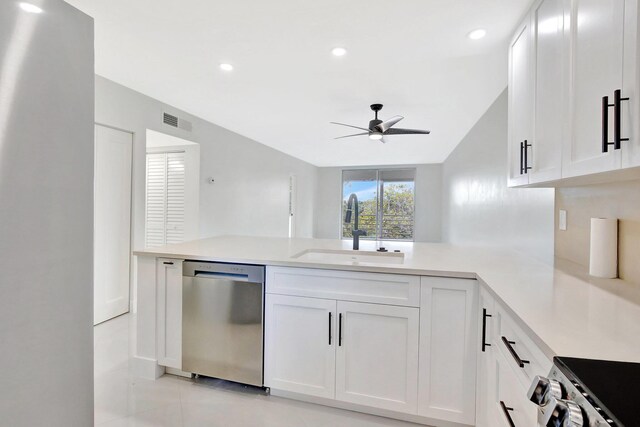 kitchen featuring a sink, range, a peninsula, stainless steel dishwasher, and visible vents