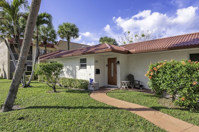 view of front of home with a front yard