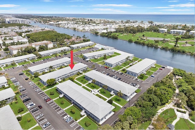 birds eye view of property featuring a water view