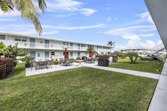 surrounding community featuring a patio and a yard