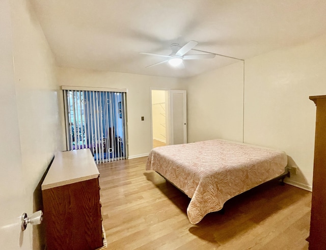 bedroom with ceiling fan and light wood-type flooring