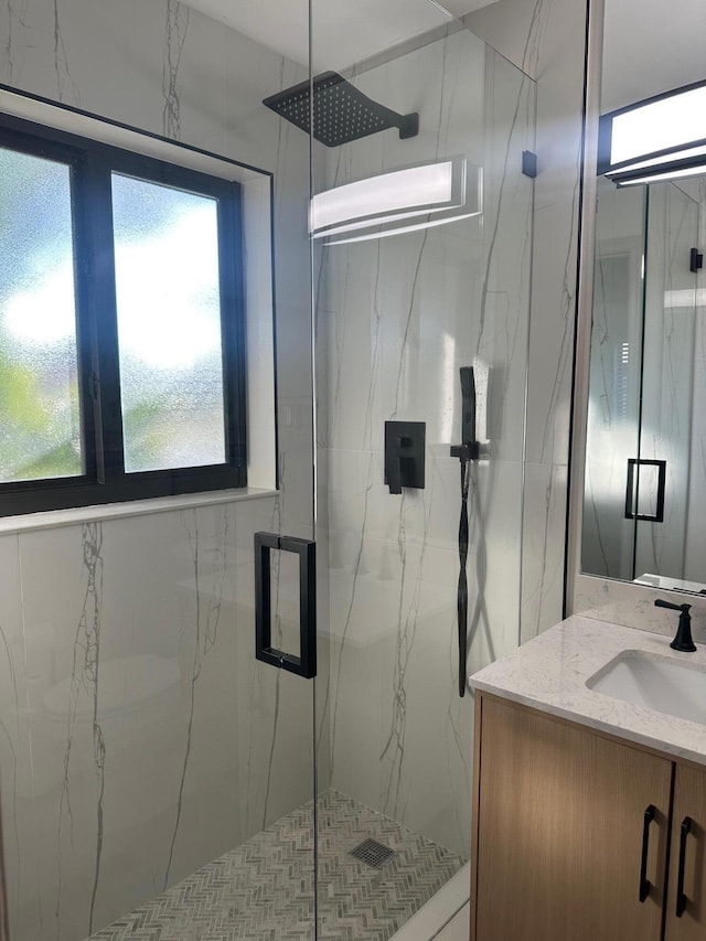 bathroom featuring vanity and walk in shower