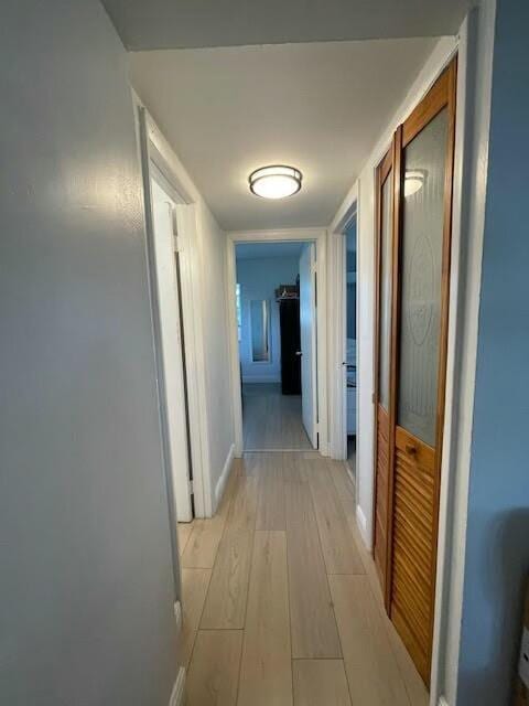 hallway with light wood-type flooring