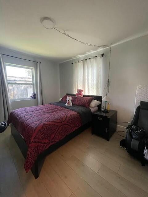 bedroom featuring light wood-type flooring