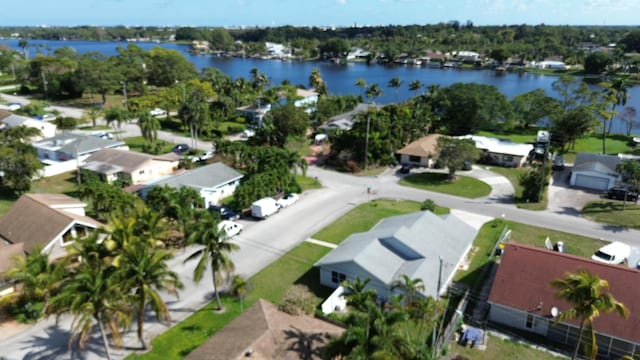 birds eye view of property featuring a water view