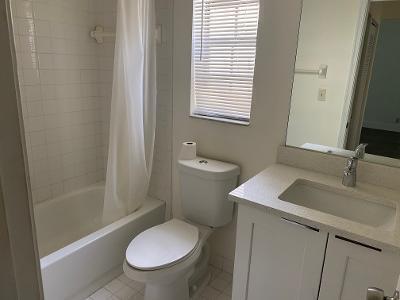 full bathroom featuring tile patterned floors, toilet, shower / bath combination with curtain, and vanity