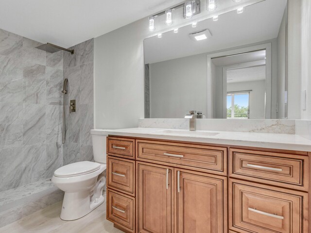 2030 Hythe B 2030, Boca Raton, FL 33434 - bathroom featuring vanity, toilet, and a tile shower