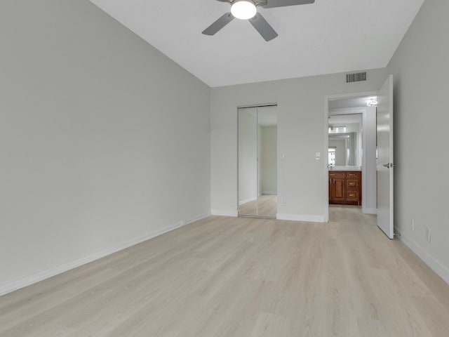 2030 Hythe B 2030, Boca Raton, FL 33434 - unfurnished bedroom featuring ceiling fan, a closet, and light hardwood / wood-style flooring