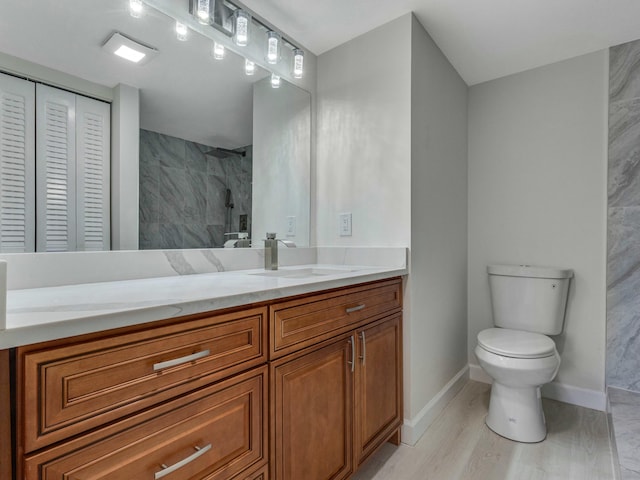 2030 Hythe B 2030, Boca Raton, FL 33434 - bathroom with vanity, toilet, wood-type flooring, and a shower