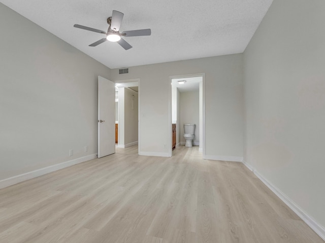 2030 Hythe B 2030, Boca Raton, FL 33434 - unfurnished bedroom featuring ensuite bathroom, ceiling fan, a textured ceiling, and light hardwood / wood-style floors