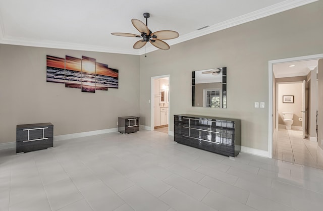 interior space featuring connected bathroom, ceiling fan, light tile patterned floors, and crown molding